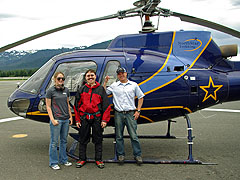 In front of helicopter with pilot Christian