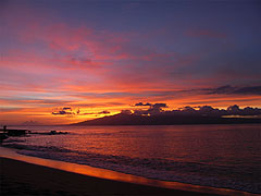 Lovers embracing at sunset on Napili Bay