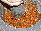 Pounding chillies with roasted garlic and shallots