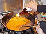 Seasoning the paste after frying in coconut cream