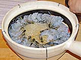 Arranging prawns atop bean threads