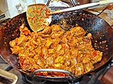 Searing pork in the wok before stewing