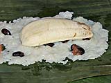 Banana placed face down on the sticky rice