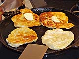 Frying plain roti with plenty of palm margarine