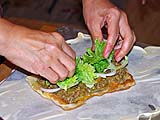 Assembling savory fillings for stuffed roti mataba