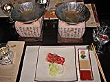 Shabu shabu ingredients with charcoal-heated bowls