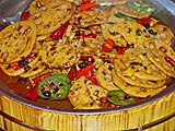 Sauteed Lotus Root With Chili In Wooden Tub