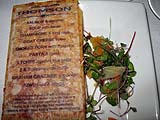 Flatbread featuring the evening's menu, with microgreens and kumquat