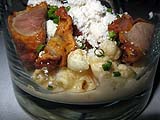 Macaroni and aged cheddar cheese with chicken-fried quail and truffle powder